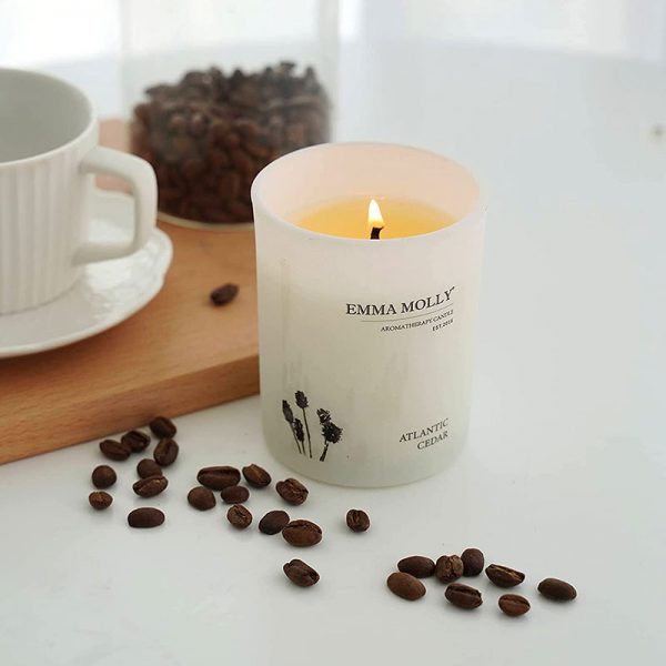 Emma Molly Atlantic Cedar Scented Candle on the table