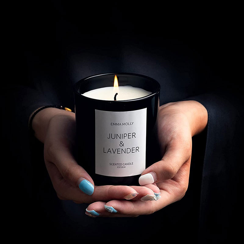 emma molly juniper and lavender scented candle on hands